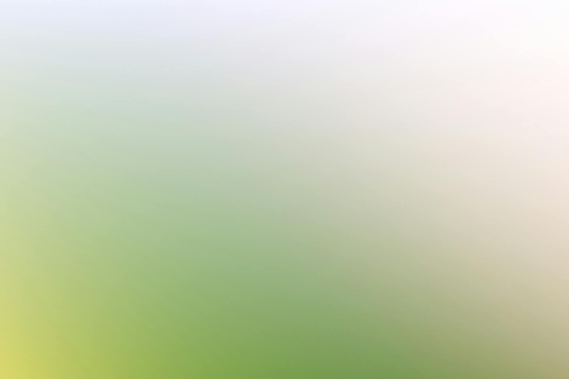 Jasne pastelowe tło abstrakcyjne z zielenią, bielą i żółtymi światłami